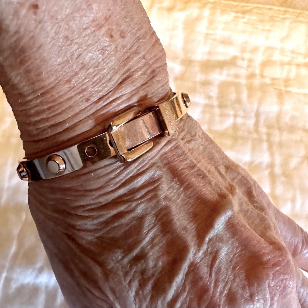 A Michael Kors Rose Gold Tone Belt Buckle Style Bracelet